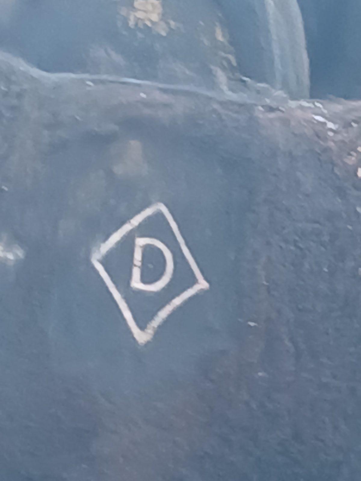Diamond D brand on a black Angus cow